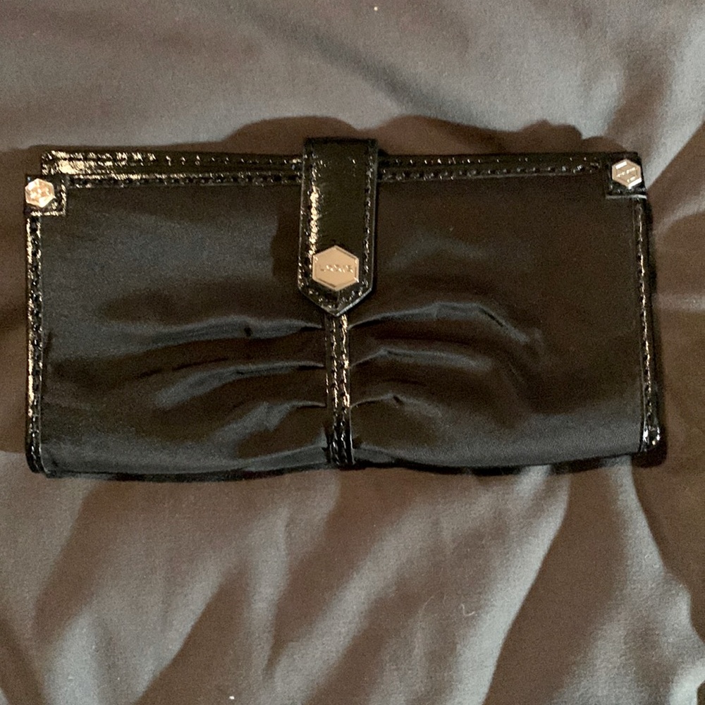 Black nylon and patent leather wallet. Zipper compartment
